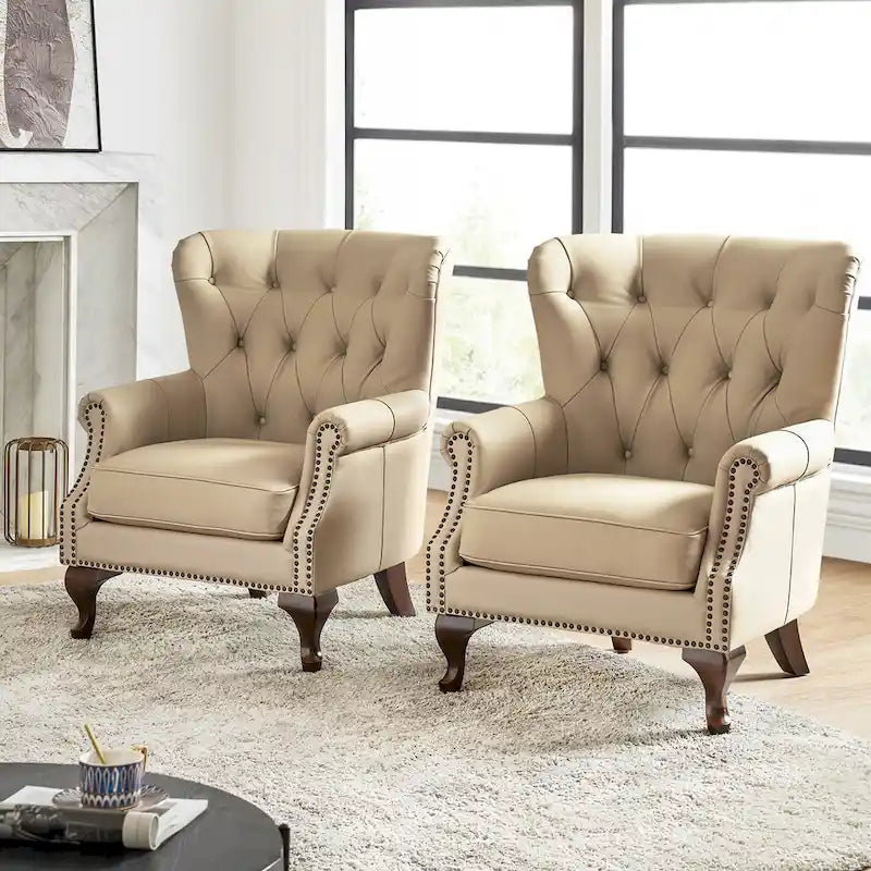 Poltrona trapuntata con schienale alto e borchie decorative, cuscino di seduta rimovibile